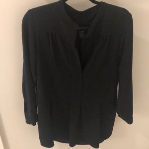 Black tunic with piped detail on sleeves